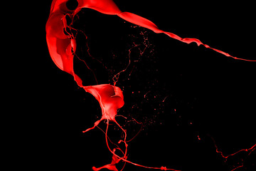 Red paint splash isolated on black background.