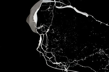 White paint splash isolated on black background.