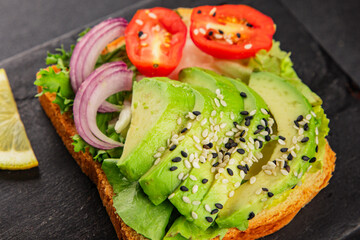 Avocado toast vegetable dish natural product tasty snack fresh delicious gourmet food background on the table rustic top view copy space keto and paleo diet vegan and vegan food