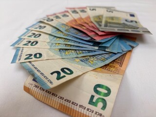 Stack of Euro Banknotes Spread on a Table European Currency Money Background