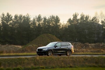 Fototapeta premium Vehicle driving on a sunny day in countryside