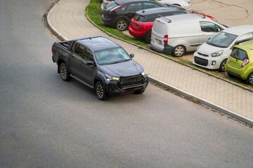 Fototapeta premium Gray utility vehicle on roadside