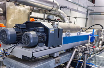 Naklejka premium decanter centrifuge industrial machine that separates solid materials from liquids using high-speed rotation and centrifugal force