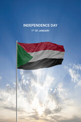 Waving flag of Sudan in beautiful blue sky for National holiday