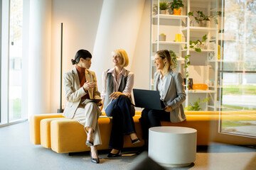 Business colleagues discussing ideas in a modern office setting during the day