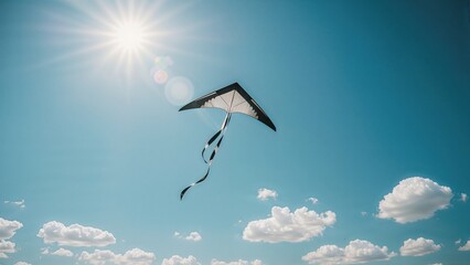A kite flying in the daytime sky with clouds and the sun shining brightly.