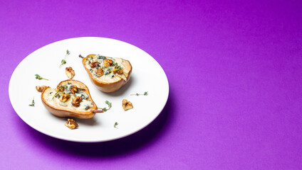Baked pear with blue cheese, honey, and nuts. Healthy eating. Vegetarian food.