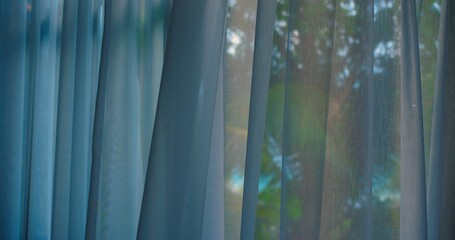 sheer curtain with colorful light reflections, soft prism glow and bokeh, evening calm for staycation