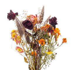 Dried bouquet with wilted roses and marigold flowers isolated on white background.