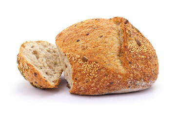 One loaf and a piece of bread with seeds.