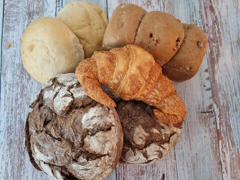 Background of a wooden board with pastry products with copy space