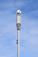 New 5G Cell Phone Tower seen from below against Blue Sky 