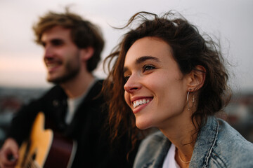 Lifestyle photography of friends playing an acoustic guitar.