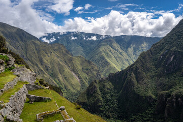Panoramic view of Machu Picchu ruins with Huayna Picchu in background, Peru