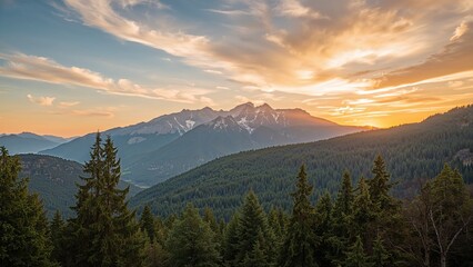 Obraz premium Scenic mountain landscape during sunset with dense forest in the foreground and mountains in the background. Nature and sunset scene.