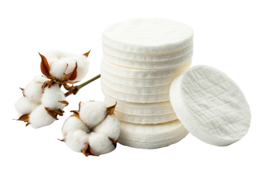 Natural fluffy cotton bolls with soft white cosmetic pads stacked and scattered for skincare product advertising and beauty applications