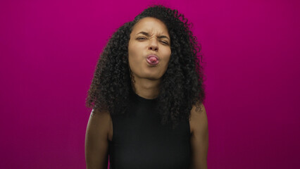 Young hispanic woman with curly hair over isolated pink background expressing emotions using hands and facial expressions
