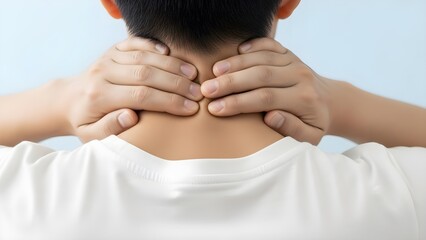 Close-up of a man massaging his painful, stiff neck and shoulders, feeling discomfort from fatigue or poor posture