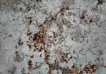 a rusty metal wall with peeling paint