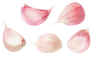 unpeeled garlic cloves on a white isolated background