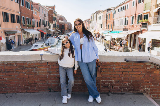 Mother and daughter enjoying family vacation in Venice, Italy - Powered by Adobe