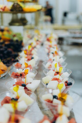 A beautifully arranged display of fresh fruits, artfully cut and styled for a wedding celebration.