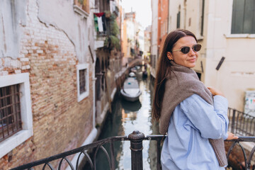 Woman traveling in Venice Italy enjoying European city exploration