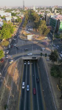 Top-down vertical view of Lazaro Cardenas avenue with visible traffic and green park area