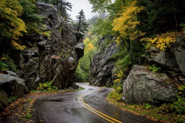 Scenic Autumn Drive Through Smugglers Notch: A Winding Road Journey Amongst Boulders in Vermont's State Park