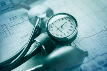 Stethoscope and medical documents. Selective focus. Blue tone image. Medical and healthcare concept.