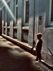 Boy Gazing Into the Light at Sunset