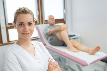 physiotherapist working with patient in clinic
