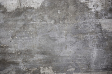 Dark gray concrete texture with noticeable rough areas and uneven, aged surfaces, grunge or industrial background