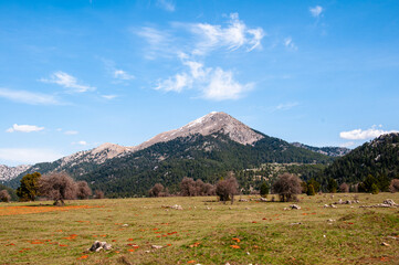 Mountain landscape with blue sky and clouds.