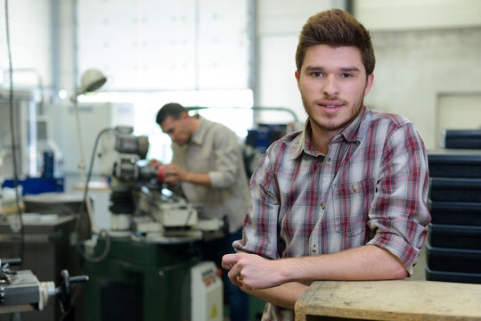 portrait of young man in workshop