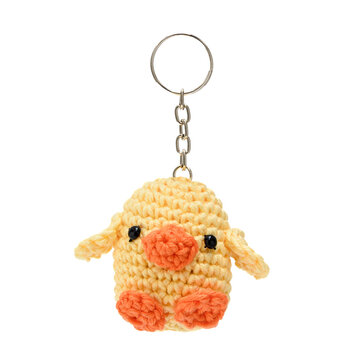 Plush duck keychain made using the amigurumi technique in yellow and orange colors on a transparent background.