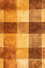 Fototapeta premium Textured background featuring warm brown and yellow squares