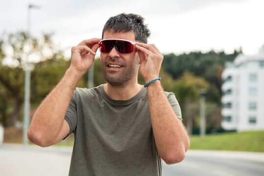 Latin man wearing sports goggles outdoors in daily life