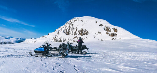 Arctic snowmobiling adventure exploring Lapland mountains
