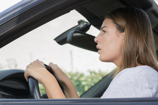 beautiful woman driving a car
