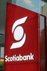 Fototapeta premium illuminated location marker sign of Scotiabank located outside 392 Bay St at Queen W, Toronto