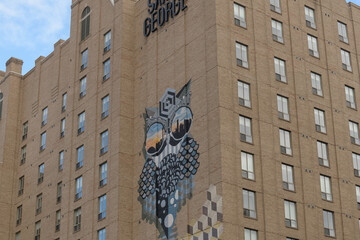 Fototapeta premium Kimpton Saint George Hotel, a boutique property at 280 Bloor St W with mural by Jerry Rugg BirdO, Toronto