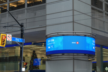 Fototapeta premium digital ring sign with time and date at First Canadian Place, BMO Bank of Montreal, King and Bay, Toronto