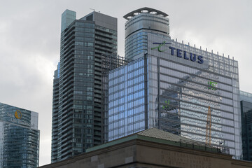 Fototapeta premium looking south to a cluster of buildings incl TELUS Harbour, a corporate office, located at 25 York St, seen here from Front St W and Bay, Toronto