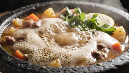 Hearty Beef Stew Simmering in a Rustic Stone Bowl A Culinary Delight with Tender Meat Potatoes Carrots and Fresh Herbs Perfect for Comfort Food and Warm Family Meals.