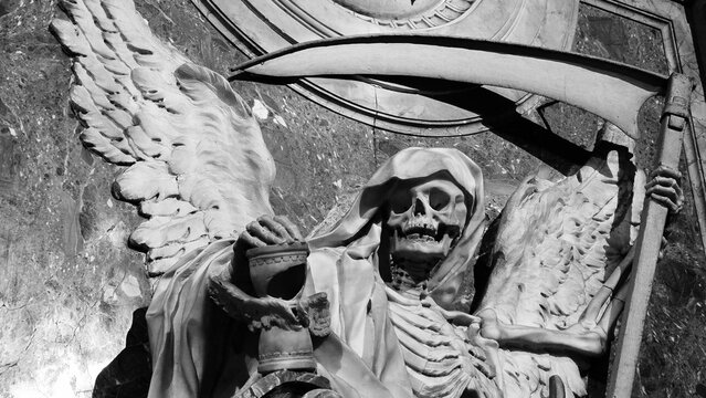 Rome, Italy – 11 January 2025. Monochrome view of winged skeleton with scythe and hourglass at San Pietro in Vincoli, carved in marble as a vivid symbol of death and passing time.