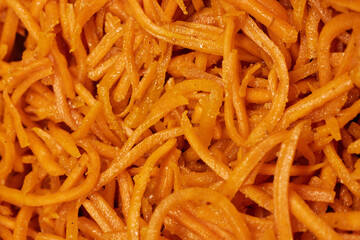 Close-Up of Spicy Korean Carrot Salad &ndash; Fresh Shredded Carrots with Seasoning