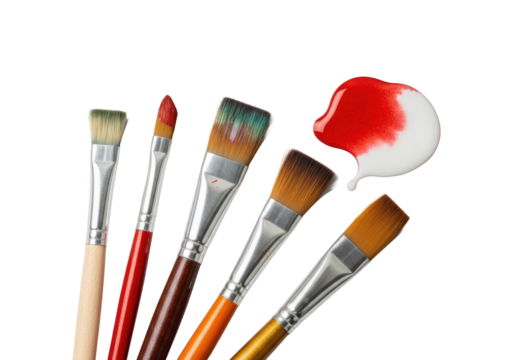 Five artist paintbrushes with varied handles, bristles, and subtle use, diagonally arranged on a transparent background with a vibrant watercolor blob, concept of artistic craftsmanship