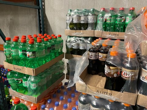 Grocery store cases of drinks in warehouse 7up Root Beer