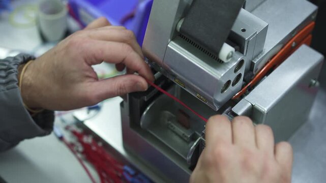 A special machine wraps insulating tape around the cable bundle